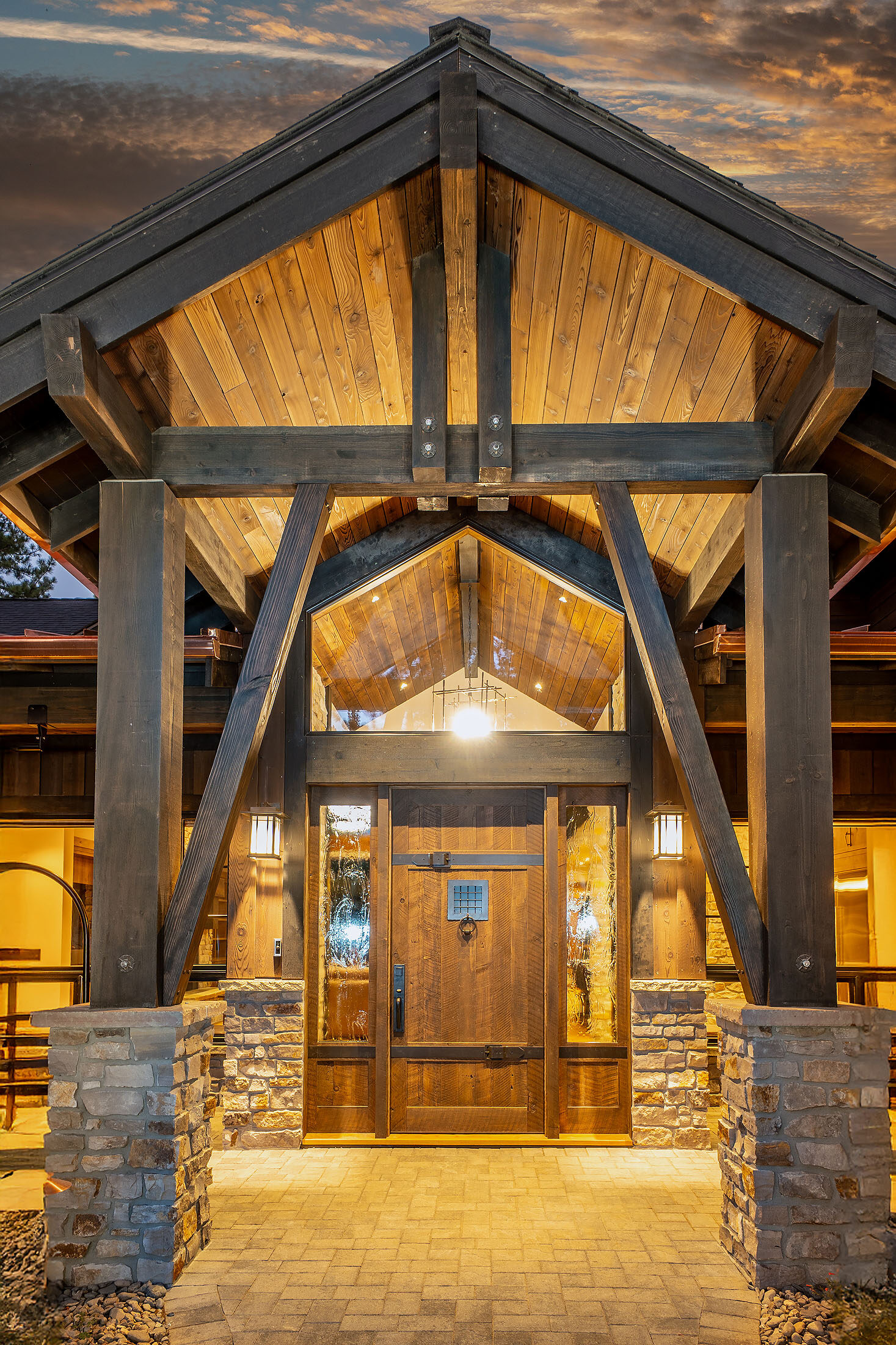 Timber entry portico framing a glowing doorway