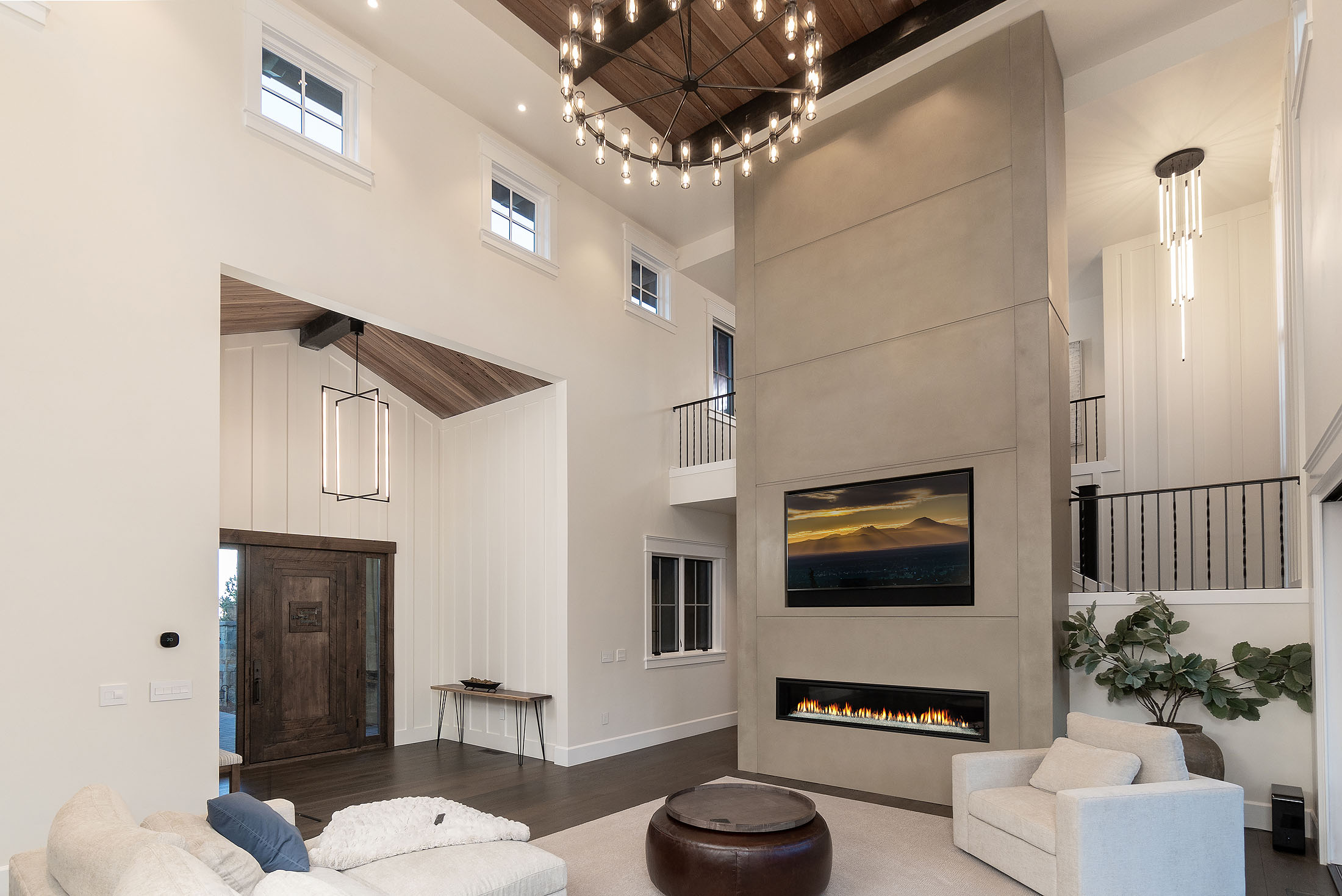 Sunrise-built North Rim great room with a soaring cement fireplace and walls of glass opening to the Cascades, Awbrey Butte, Bend