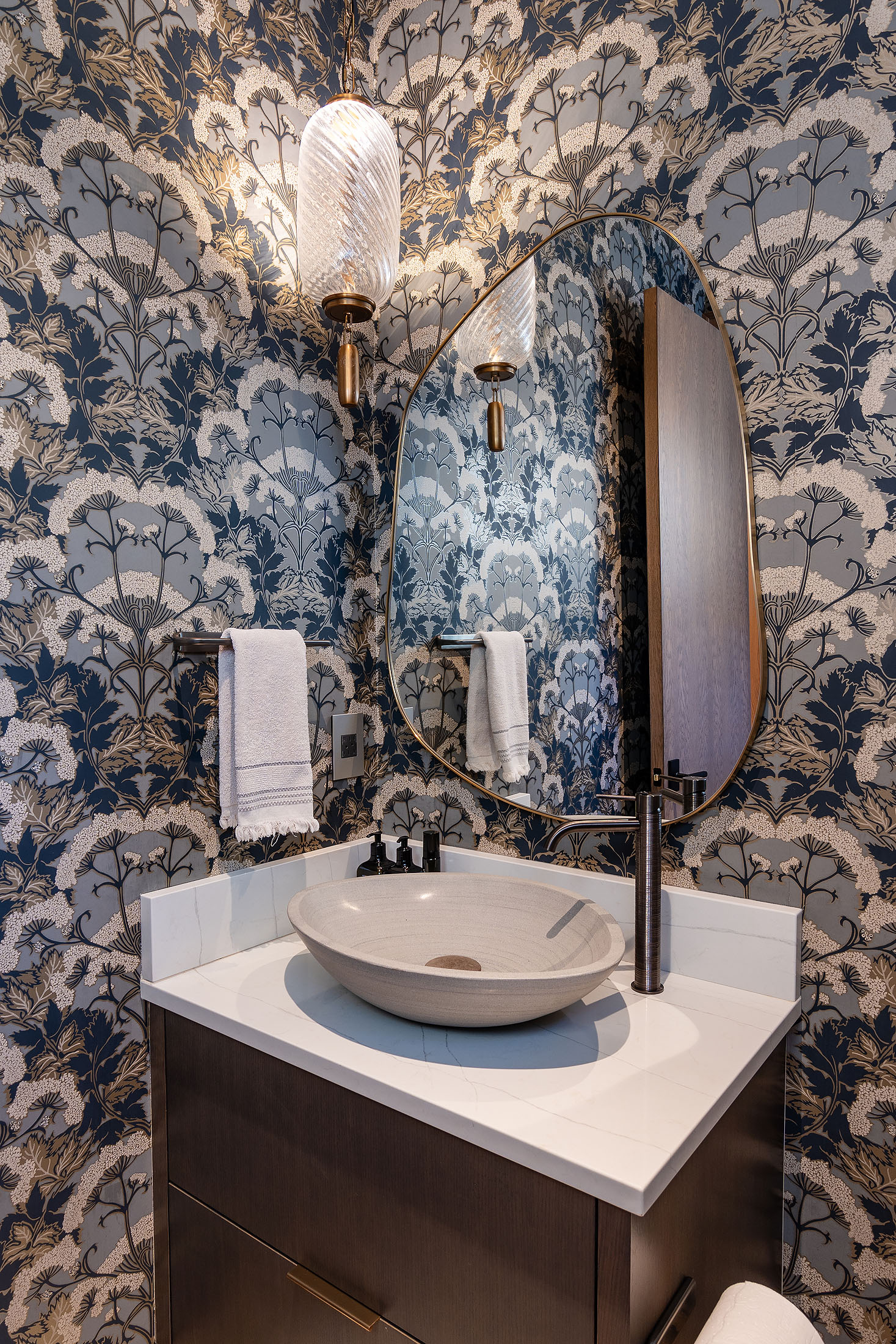 Ranch at the Canyons powder room with patterned wallpaper and stone vessel sink, Terrebonne